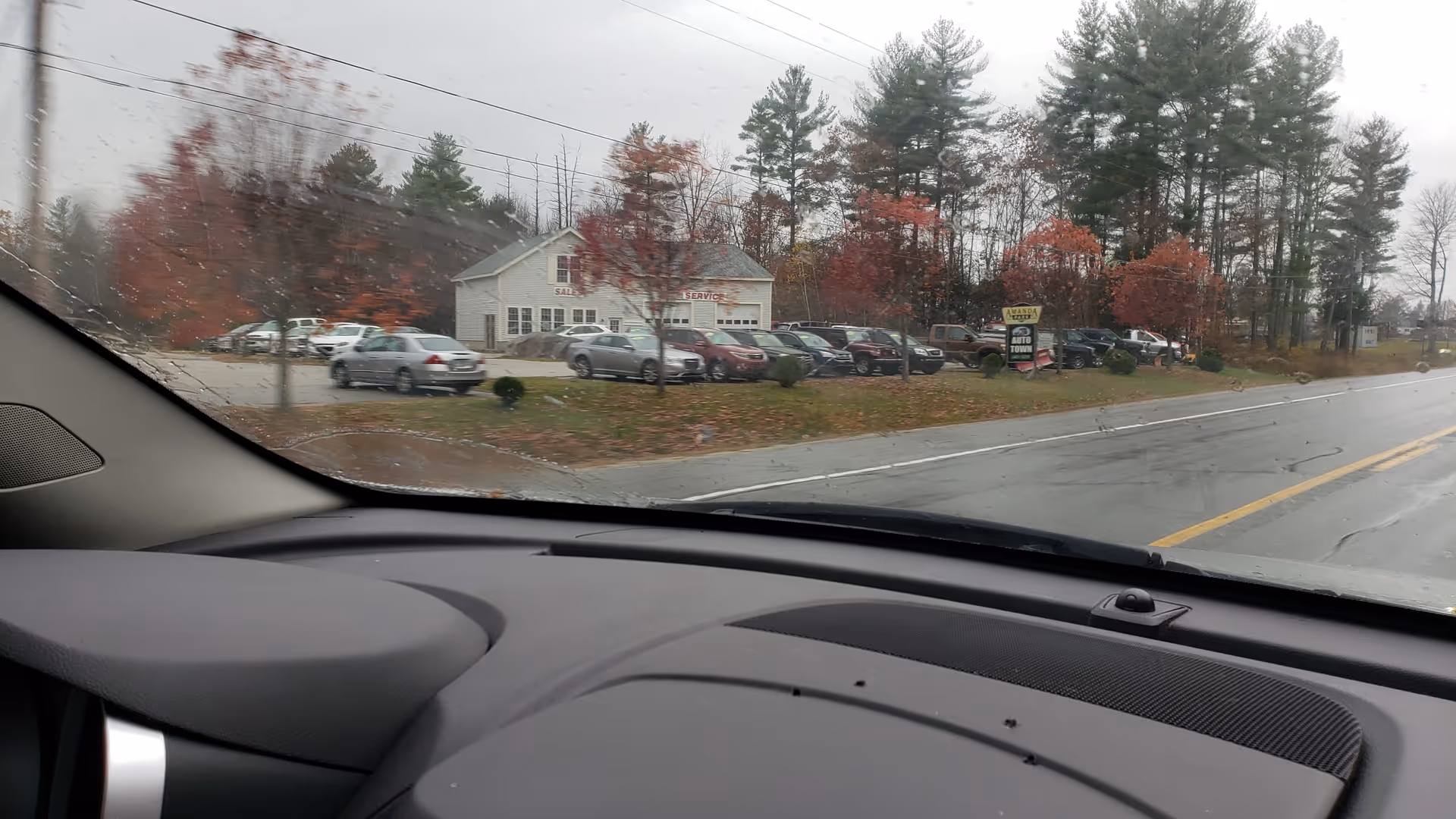 View of All American Assisted Living at Kingston exterior with parked cars across the street.
