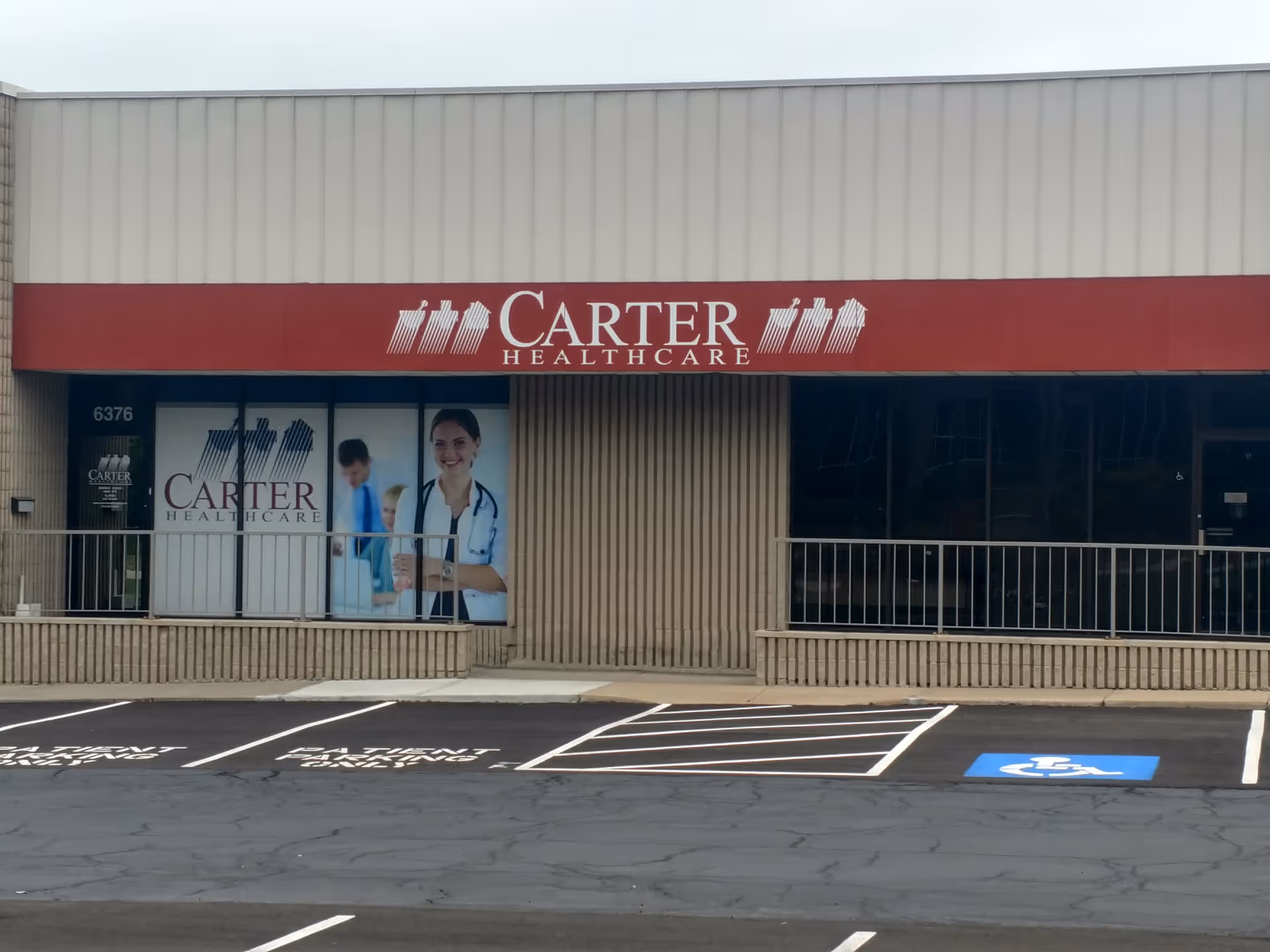 Carter Healthcare storefront with red sign and large glass windows.