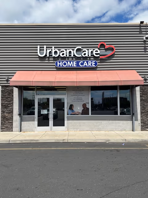 Exterior storefront of UrbanCare Home Care with a pink awning and front entrance.