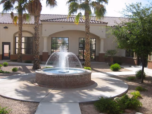 Exterior view of Phoenix Valley Home Health Care courtyard with a fountain.