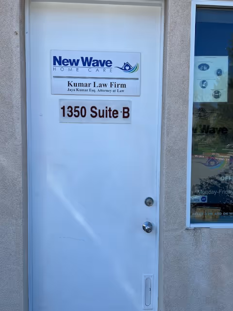 White door with New Wave Home Care sign and 1350 Suite B plaque.