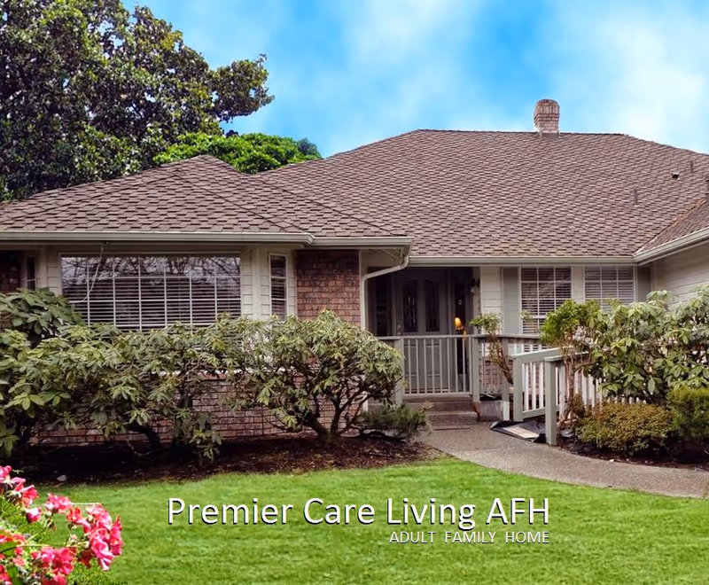 Exterior of Premier Care Living facility with front entrance and manicured landscaped yard.