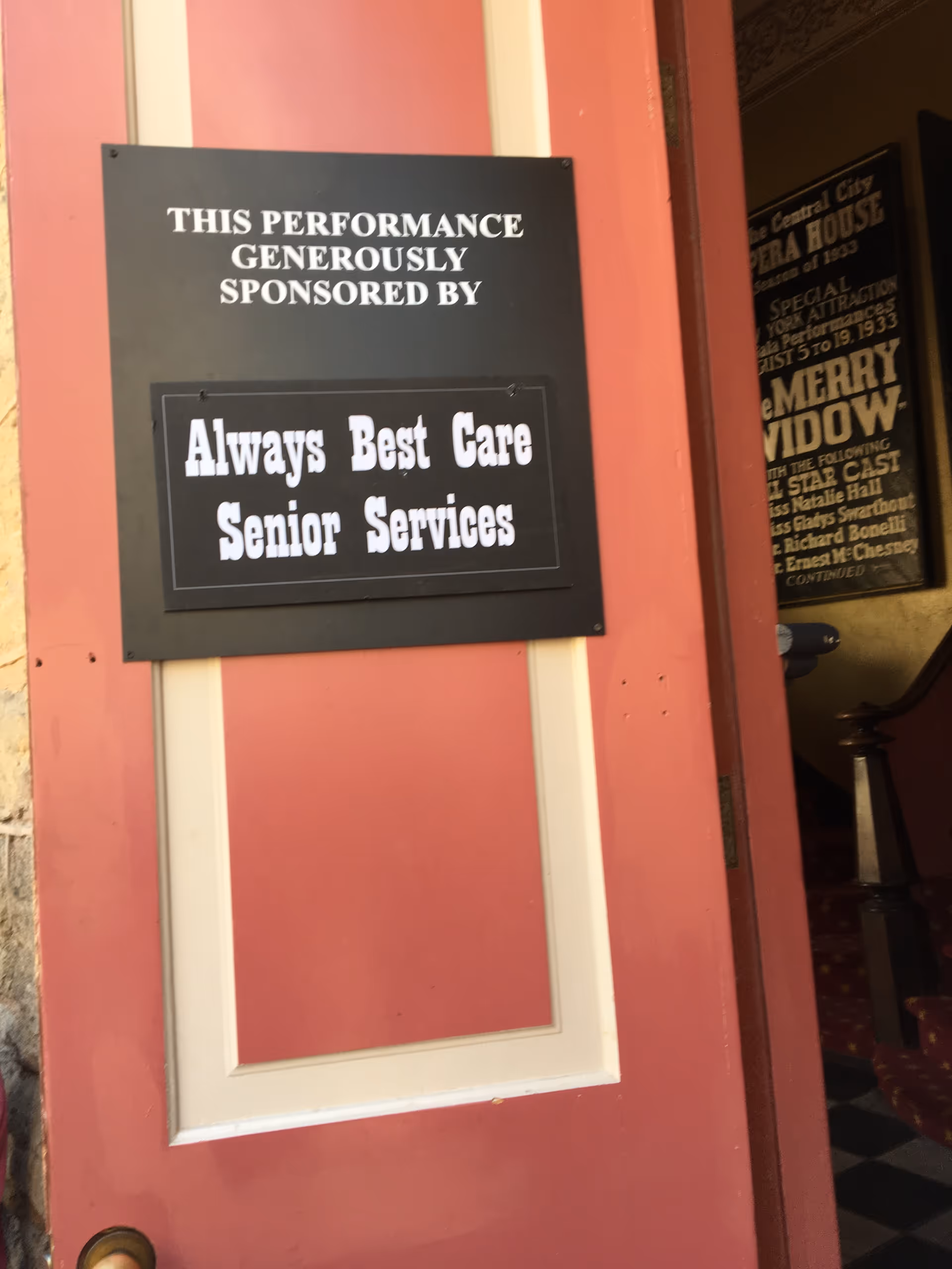 Sign on a pink door announcing Always Best Care Senior Services sponsorship.