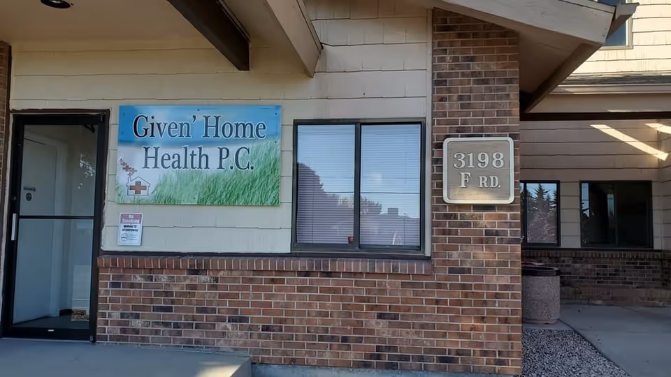 Front view of a brick building with a Given' Home Health P.C. sign.