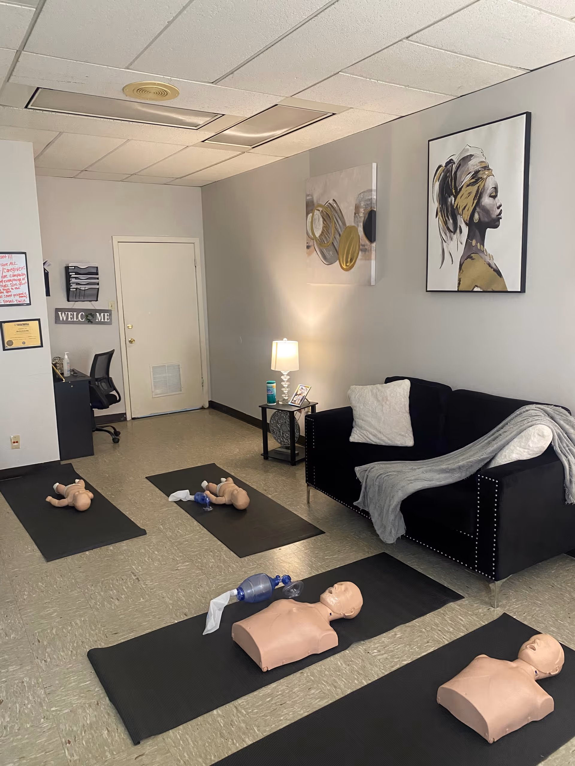 CPR training room in a senior living facility with mannequins on mats