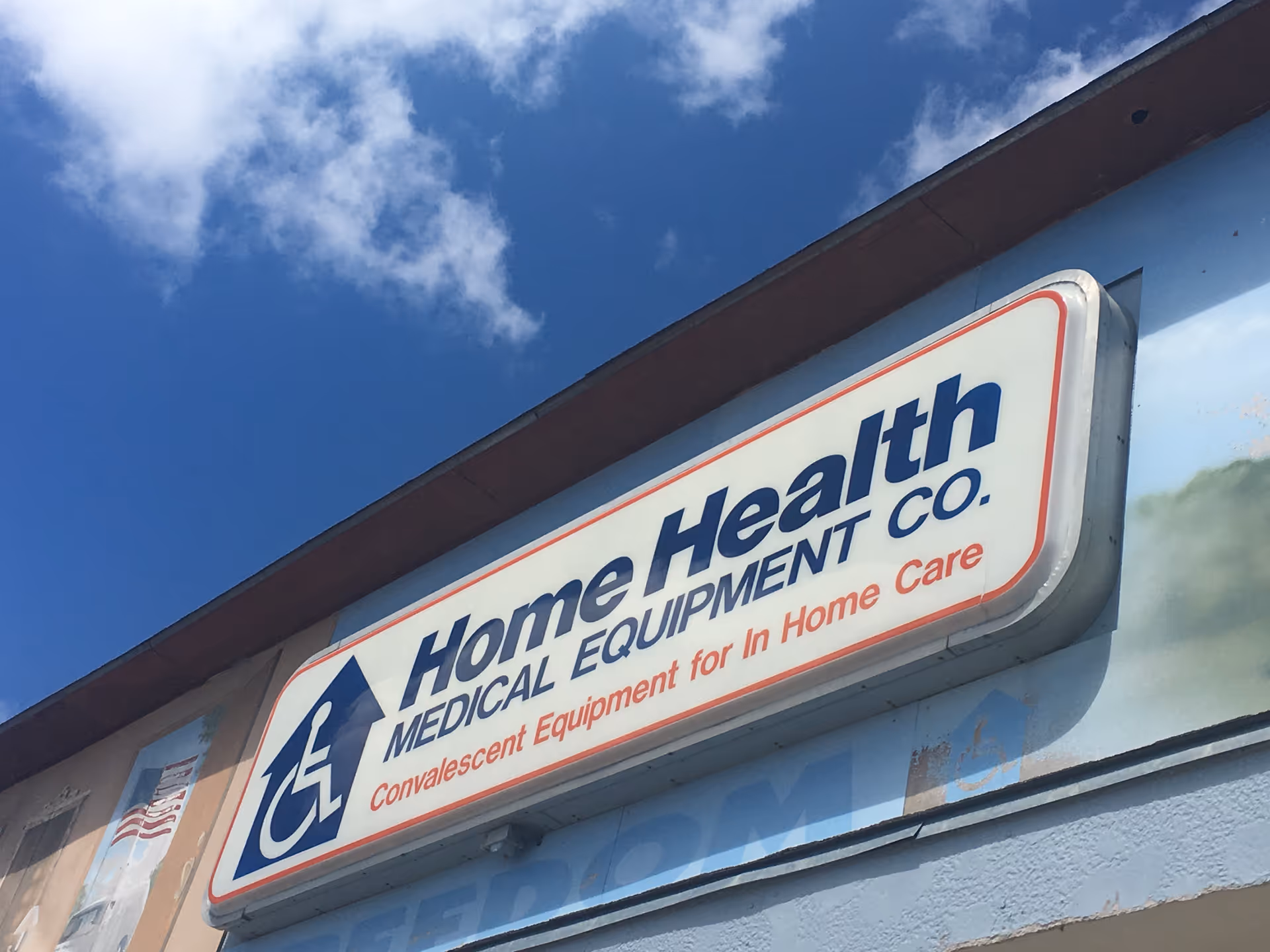 Exterior view of a building with a large Home Health Medical Equipment Co. sign.