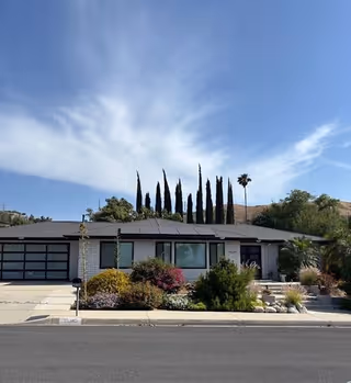 Single-story Birch Residence facility with a landscaped front yard and driveway.