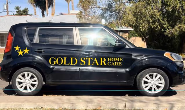 Black SUV with Gold Star Home Care branding parked on a residential street.