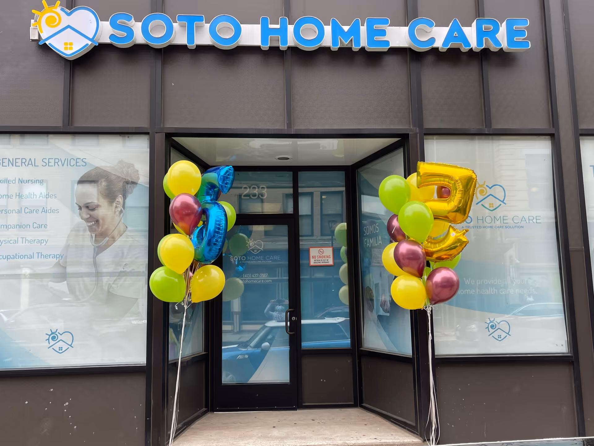 Exterior storefront of Soto Home Care with colorful balloons flanking the entrance