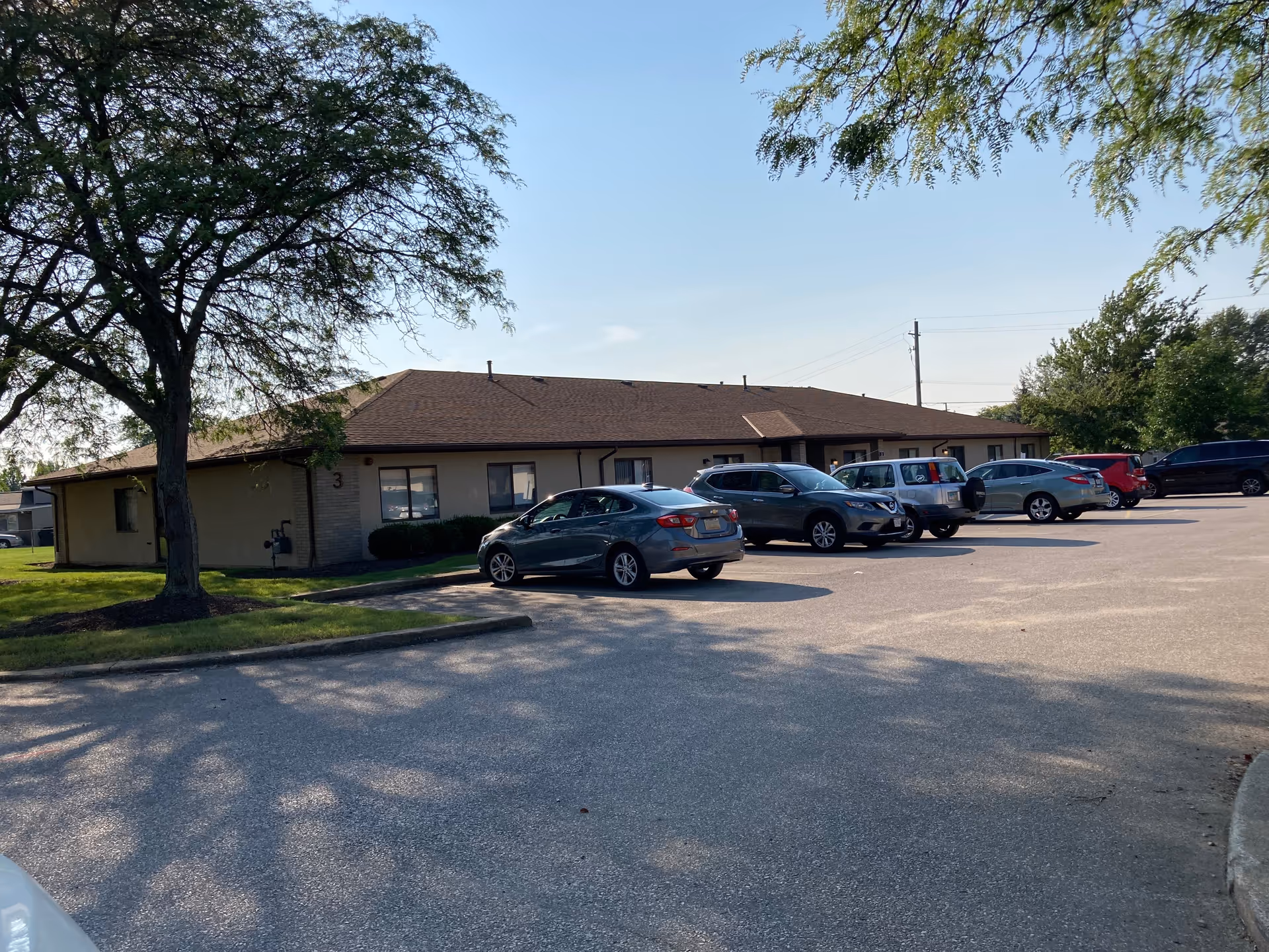 North Park Care Center, a single-story building with a long parking lot and trees.
