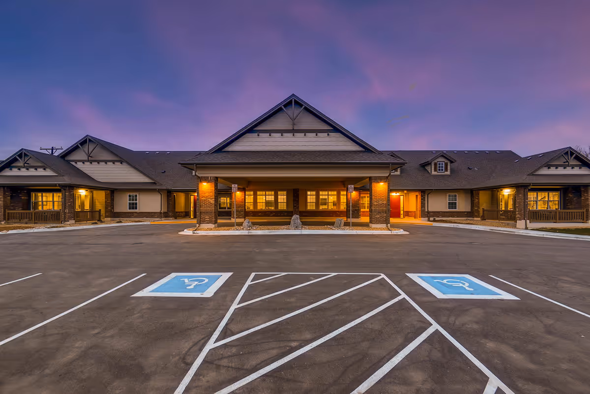 Exterior view of Rocky Mountain Assisted Living III with front entrance and accessible parking.