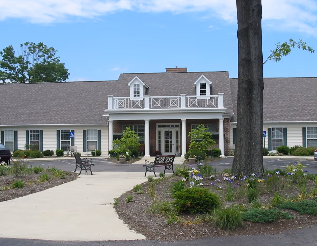 Front exterior of Abbington of Pickerington, a single-story assisted living facility with a central entrance.