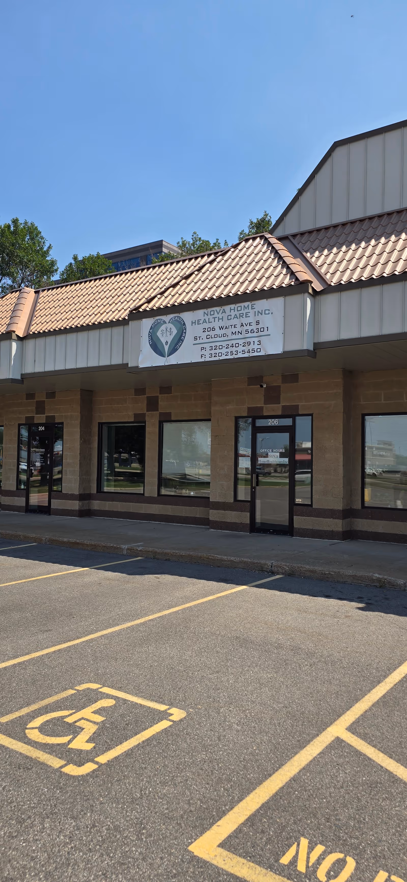 Front exterior of Nova Home Health Care building with sign and empty parking lot.