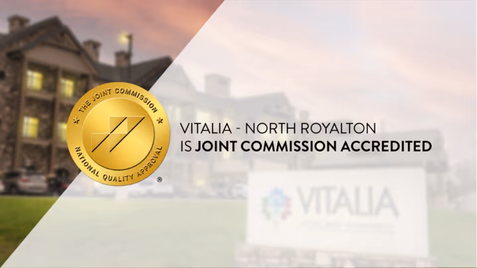 Exterior view of Vitalia Active Adult Community North Royalton building with accreditation seal overlay