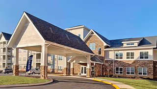 Exterior view of Richfield Living Town Center with a covered entrance and brick facade.