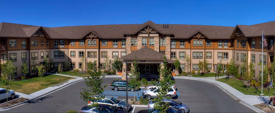 Exterior view of Luther Park at Sandpoint, front entrance with parking lot and landscaping.