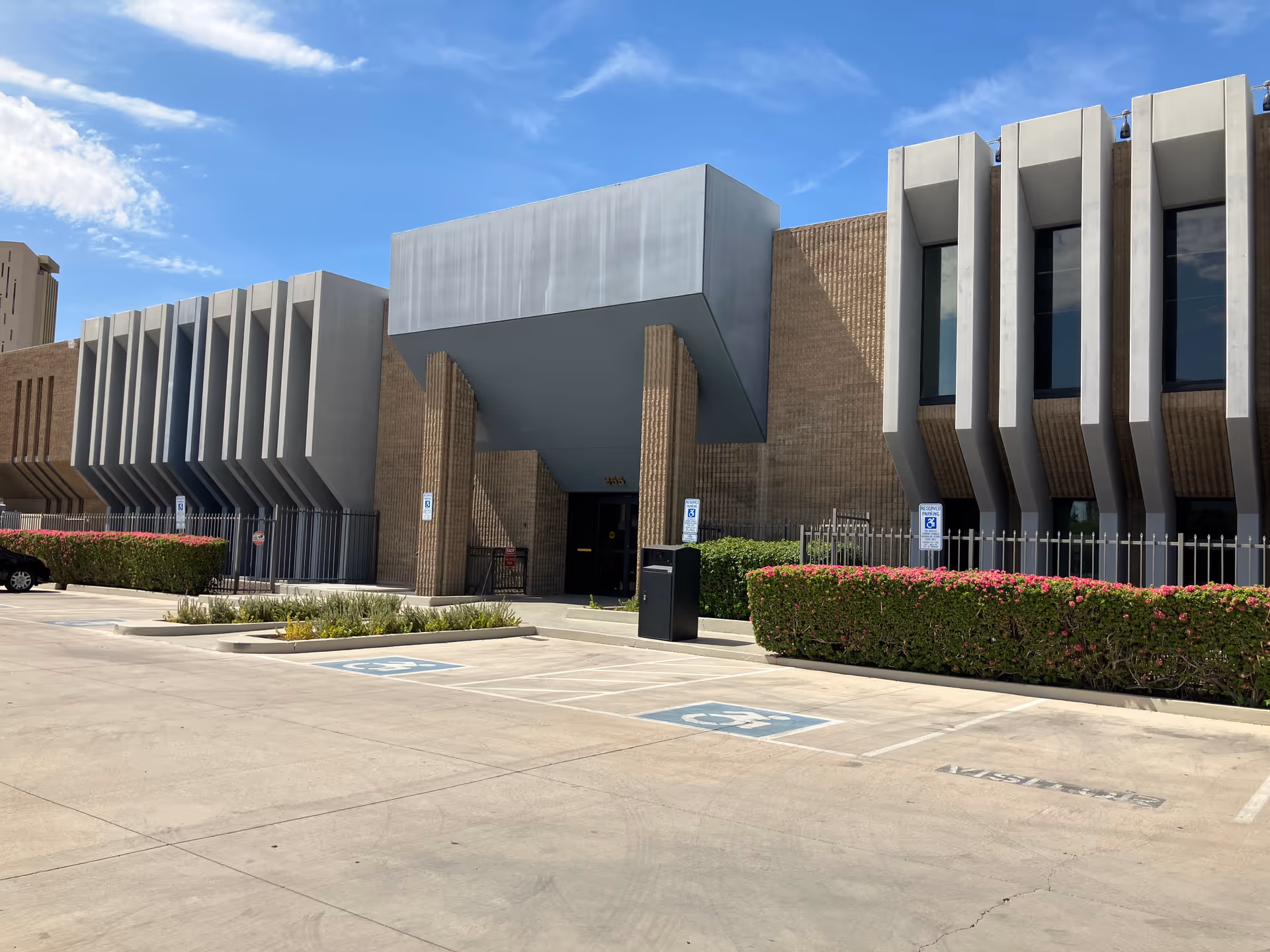 Modern exterior of Prileo Home Care facility with a large entrance and surrounding parking.