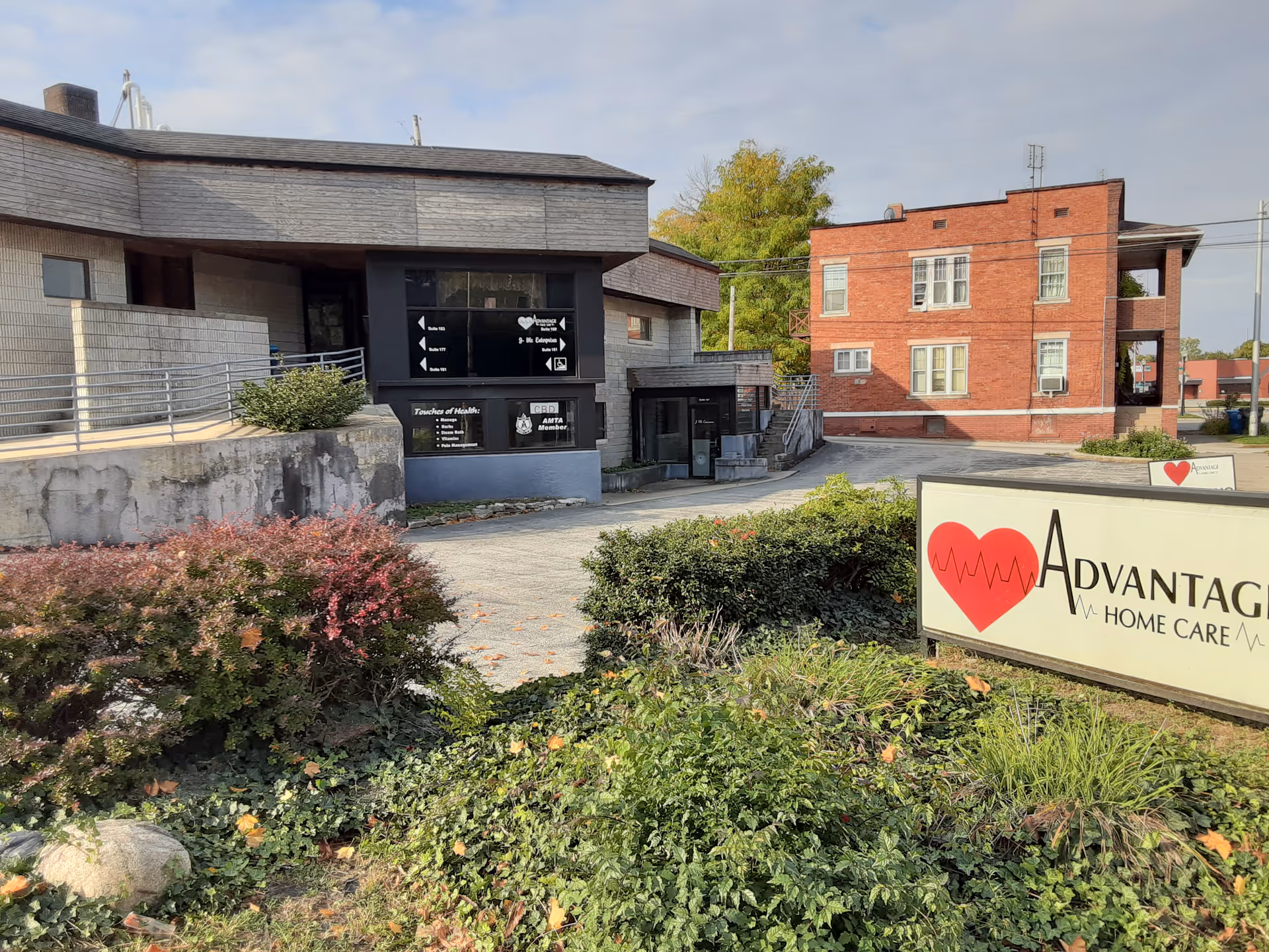 Exterior view of Advantage facility with a large sign and brick building.