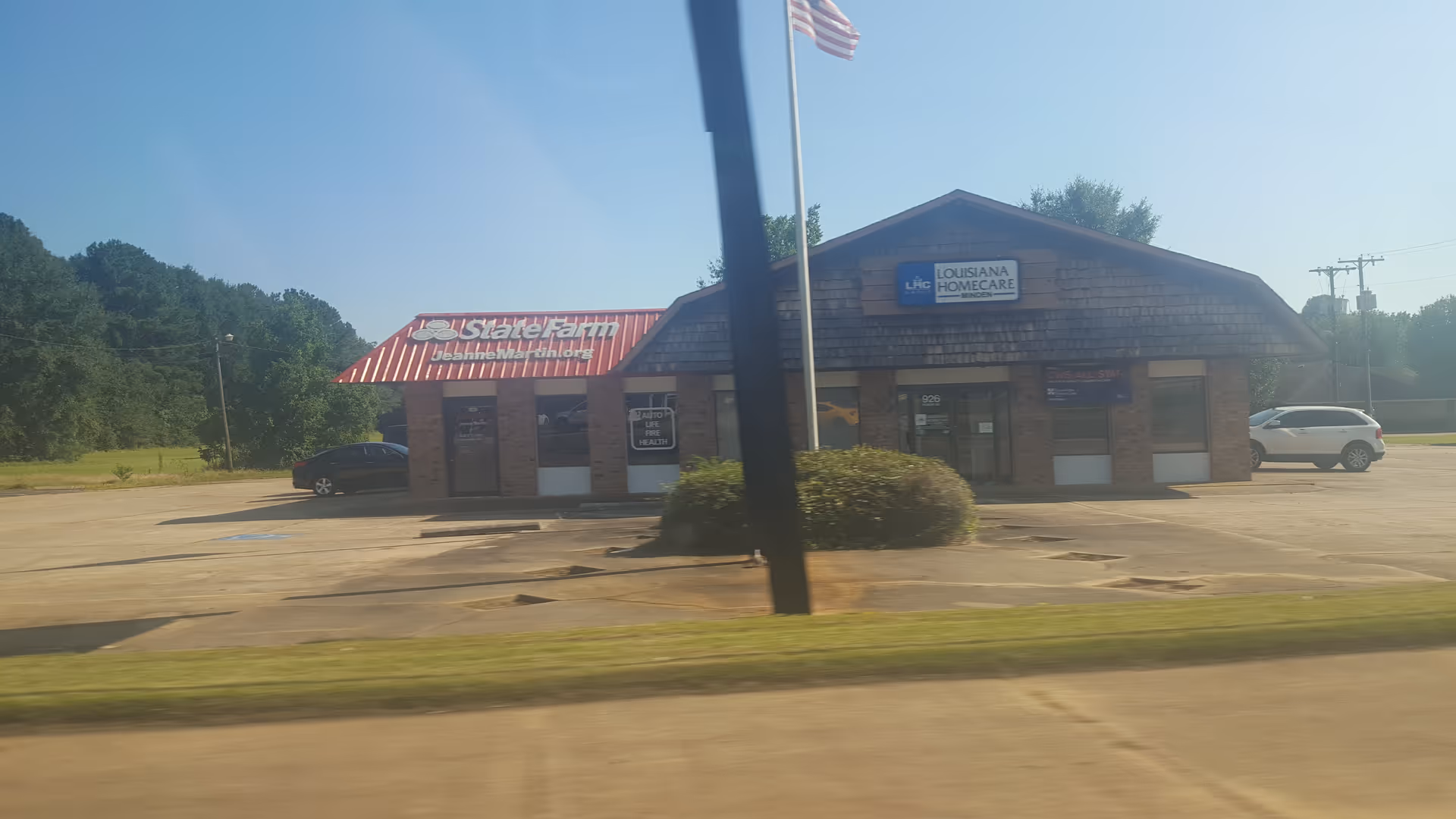 Exterior view of Louisiana Homecare building with a parking lot.