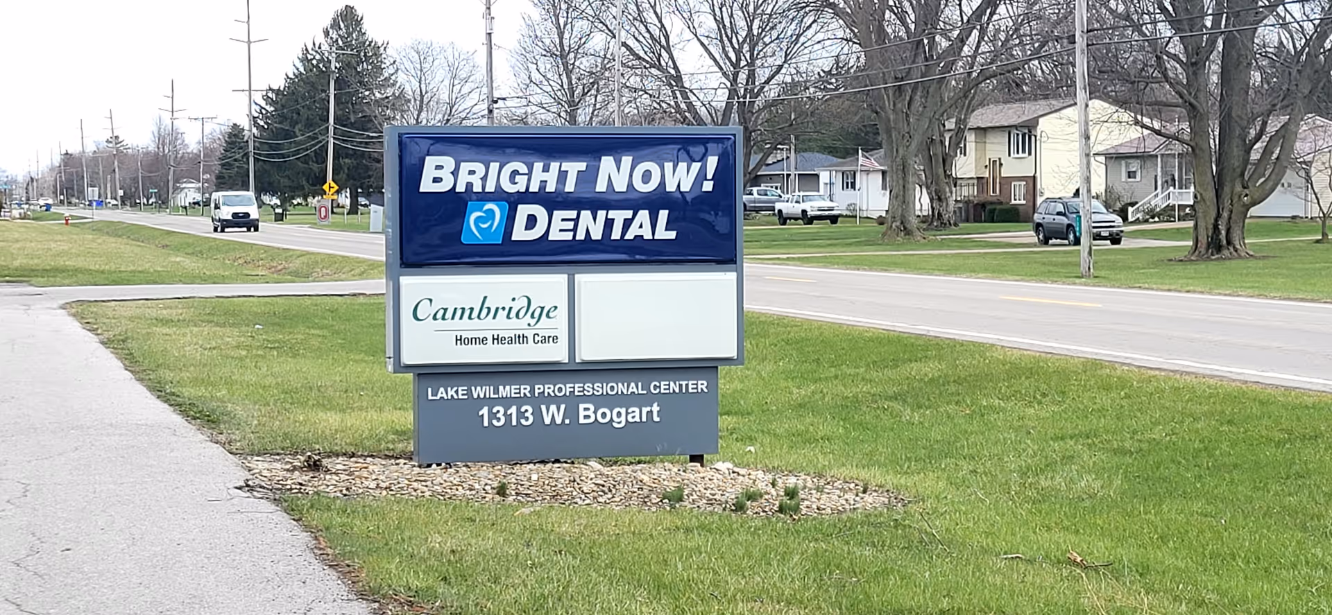 Outdoor road sign for Cambridge Home Health Care on a grassy median