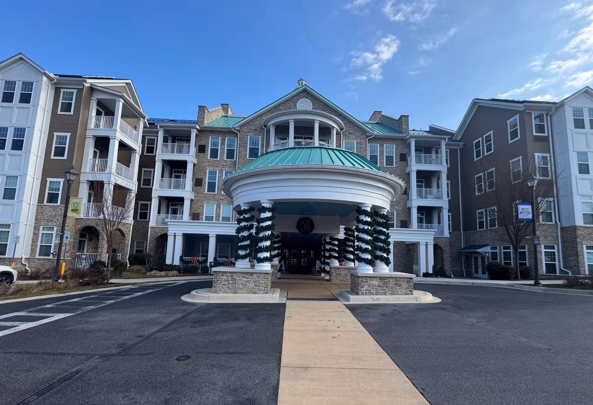Exterior view of Brightview Columbia with a circular entry canopy and surrounding residential wings