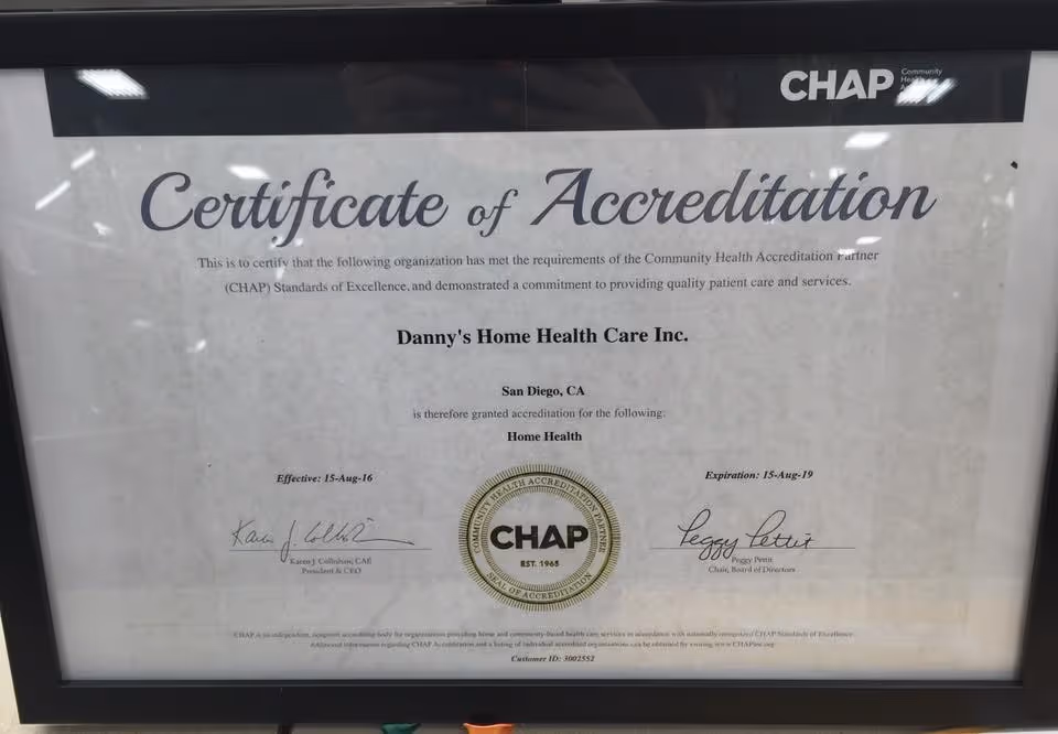 Framed Certificate of Accreditation for Danny's Home Health Care Inc. on a wall.