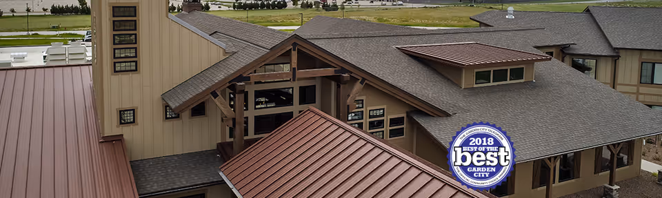 Exterior view of Ranch House Senior Living showing building rooftops and entrance with a blue award badge.