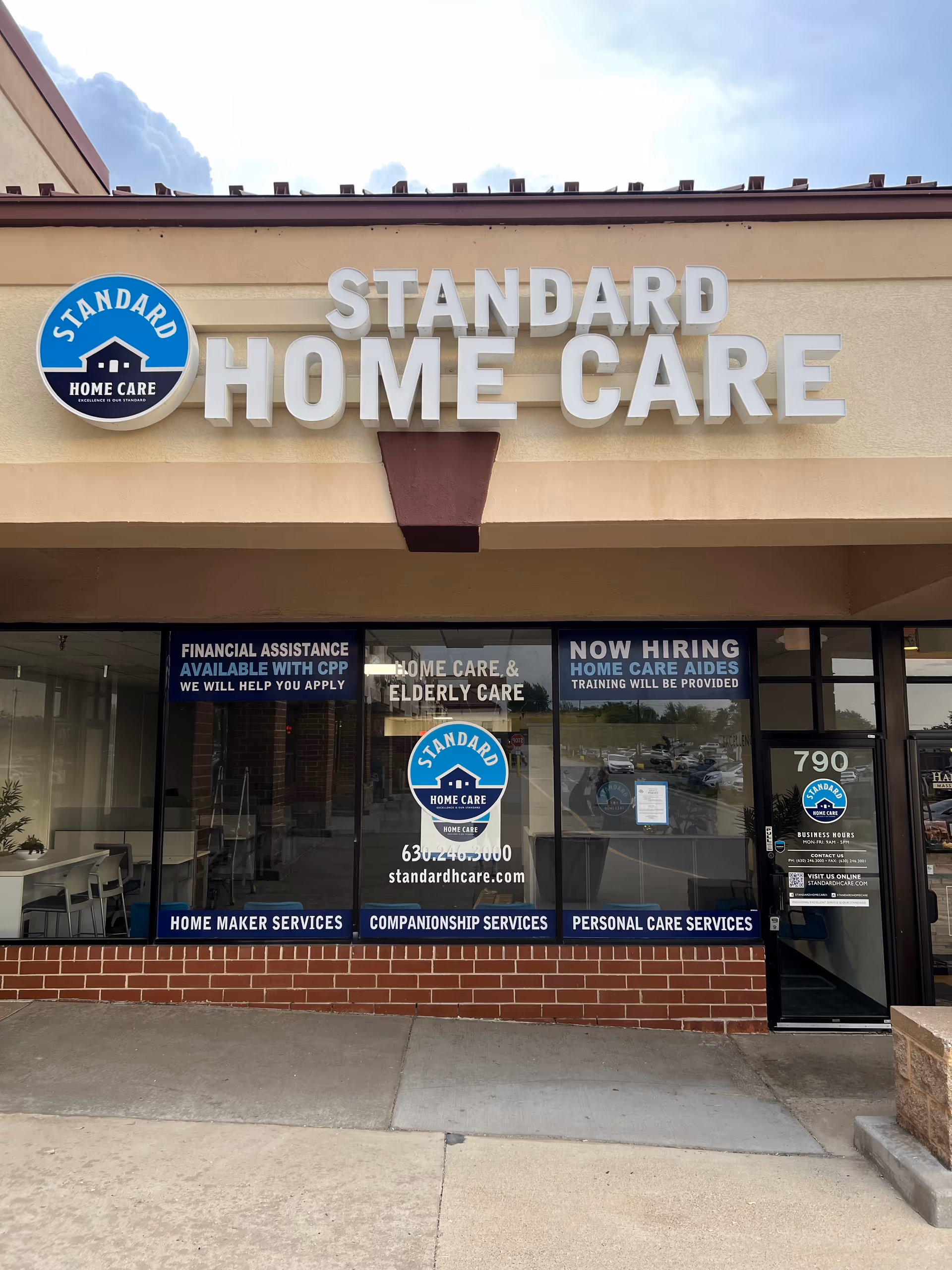 Front exterior of Standard Home Care with large signage and windows
