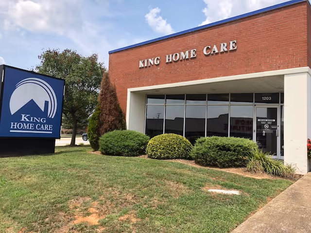 Exterior view of King Home Care building with sign and landscaped entrance.