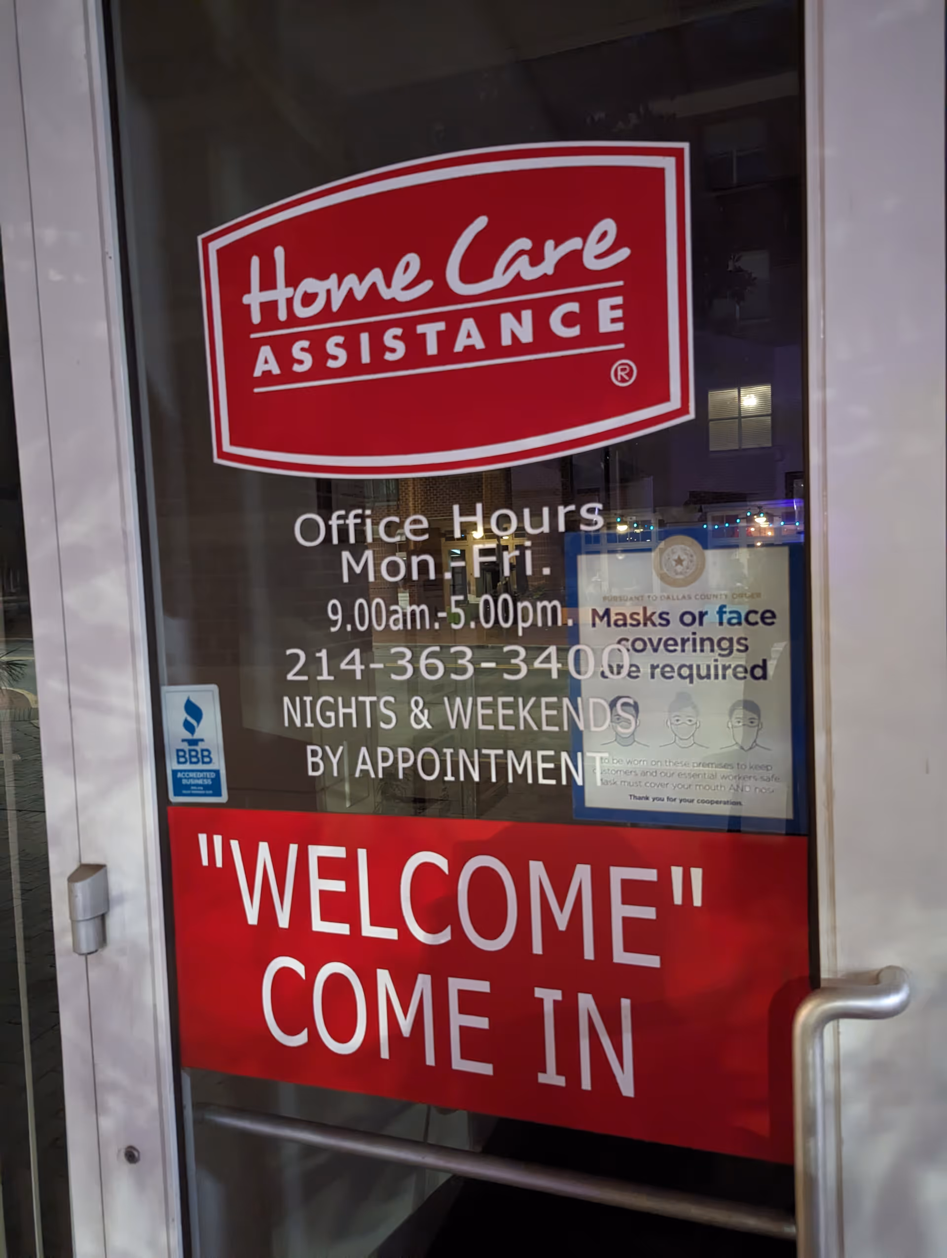 Glass door entrance displays Home Care Assistance logo and a welcoming message.