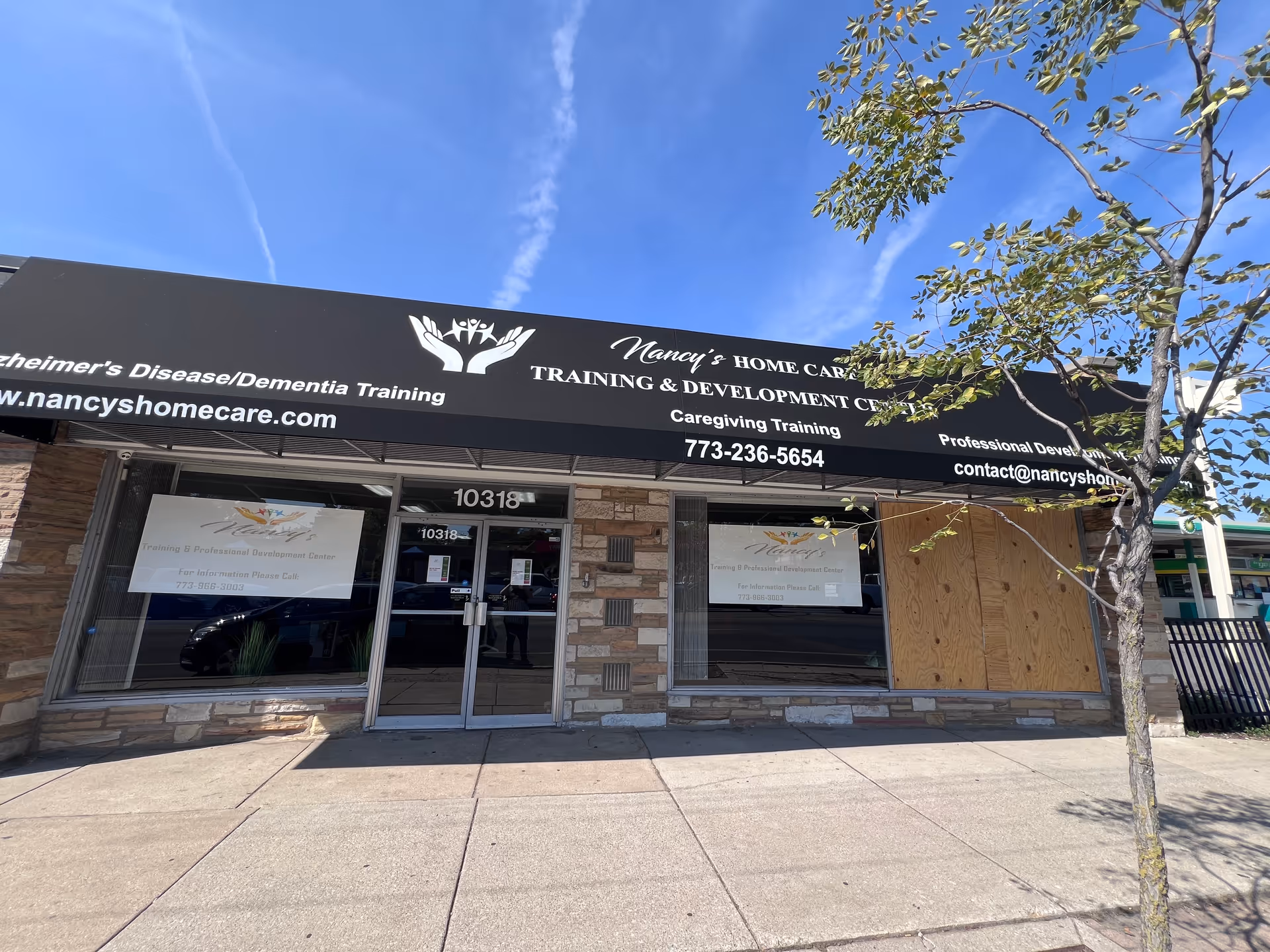 Front view of Nancy's Home Care Training & Development Center storefront with a large sign.