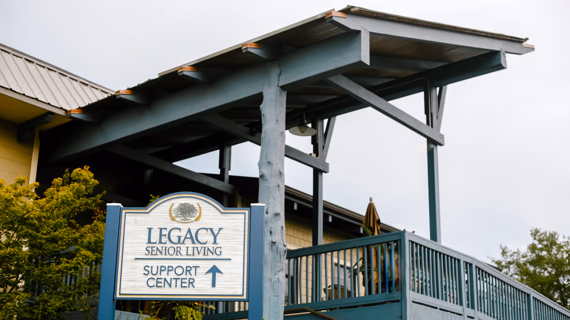 Exterior view showing Legacy Senior Living Support Center sign at the entrance.