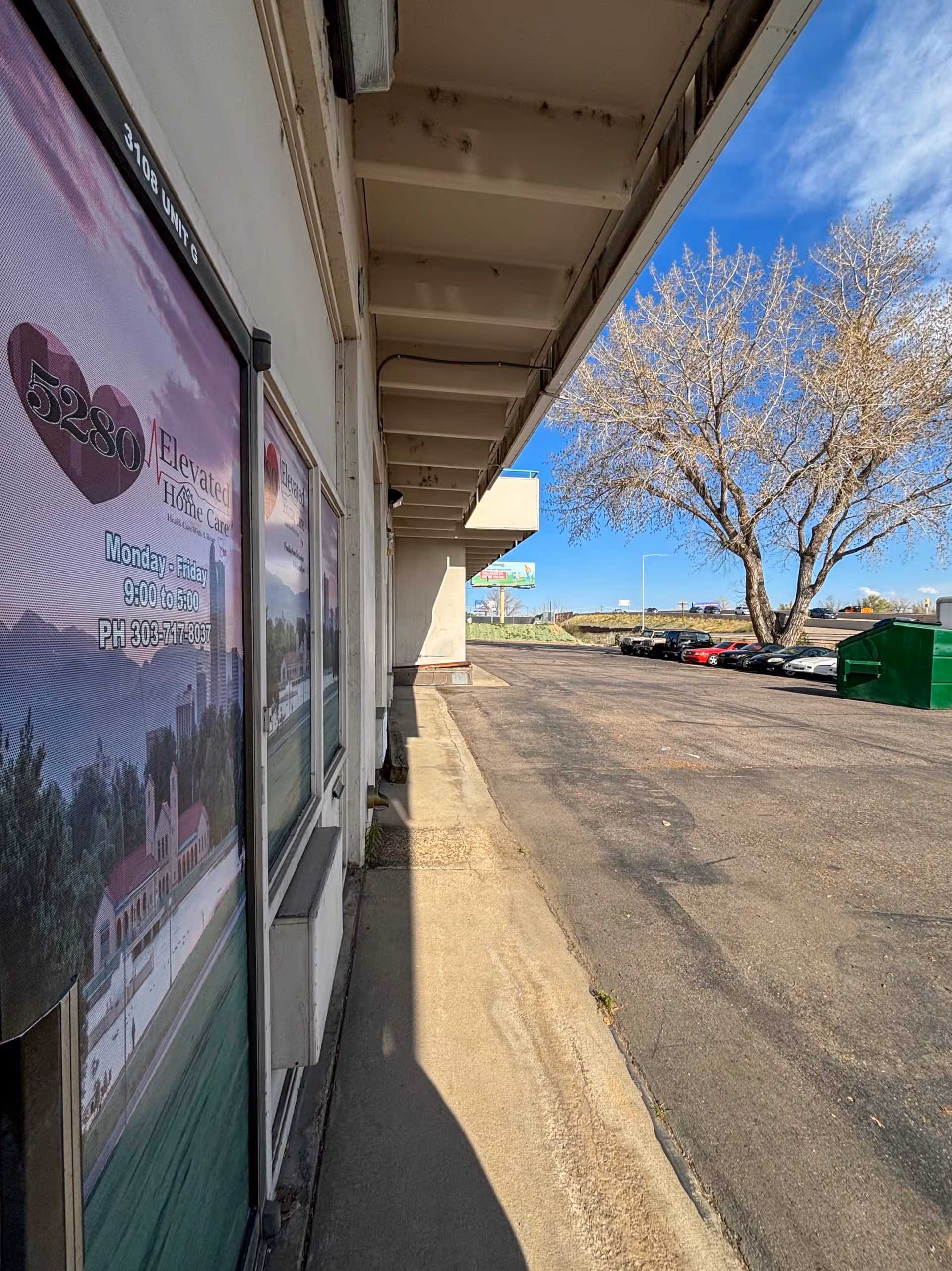 Exterior view of 5280 Elevated Home Care storefront with windows, parking lot, and trees