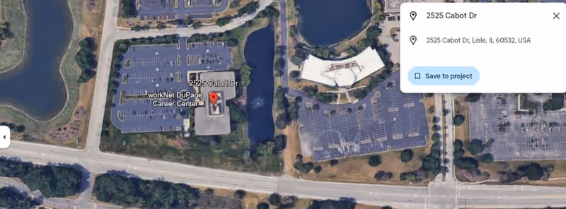 Aerial view of a senior care facility with parking lots and surrounding roads.