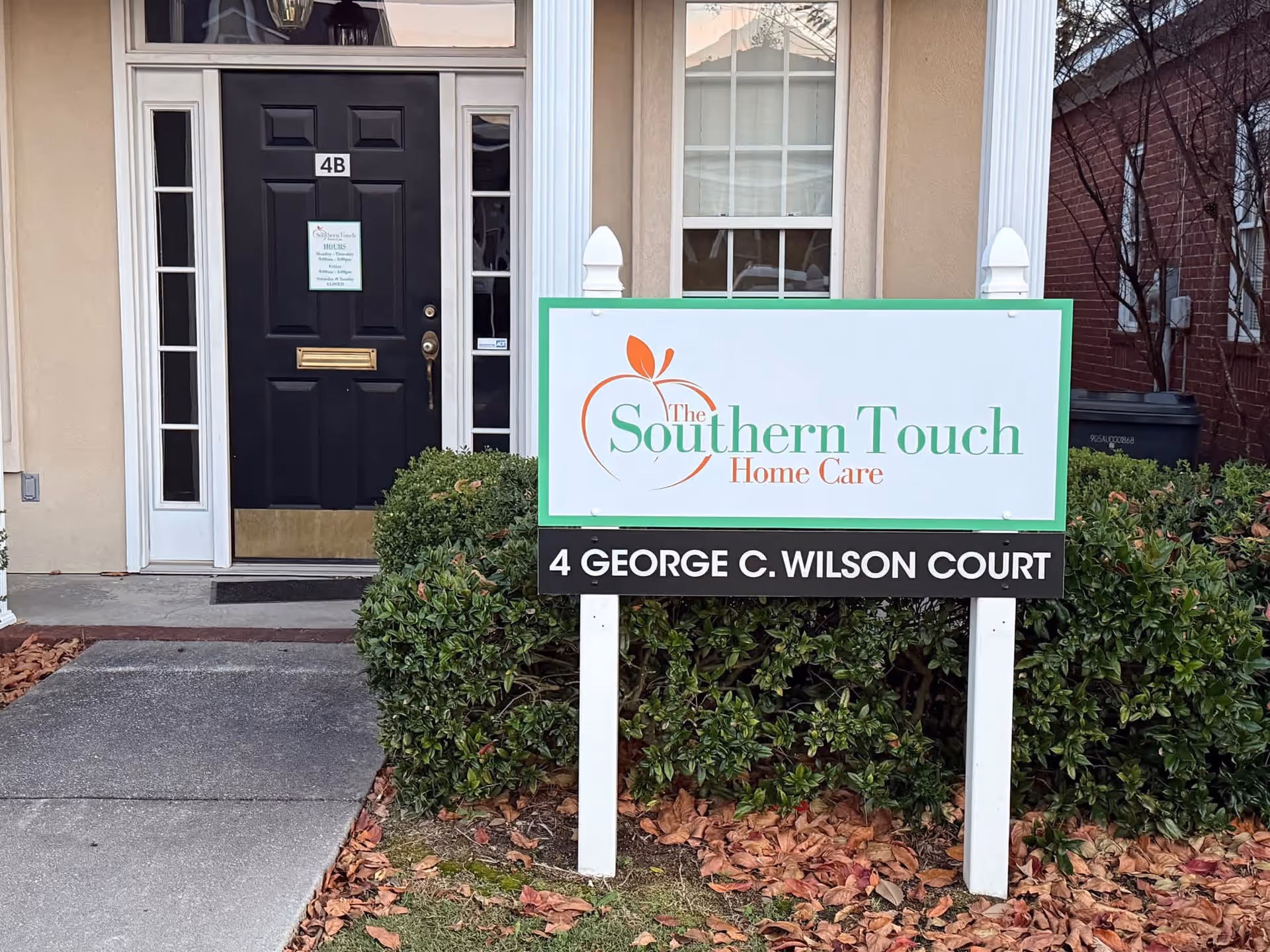 Entrance of a building with a sign for The Southern Touch Home Care