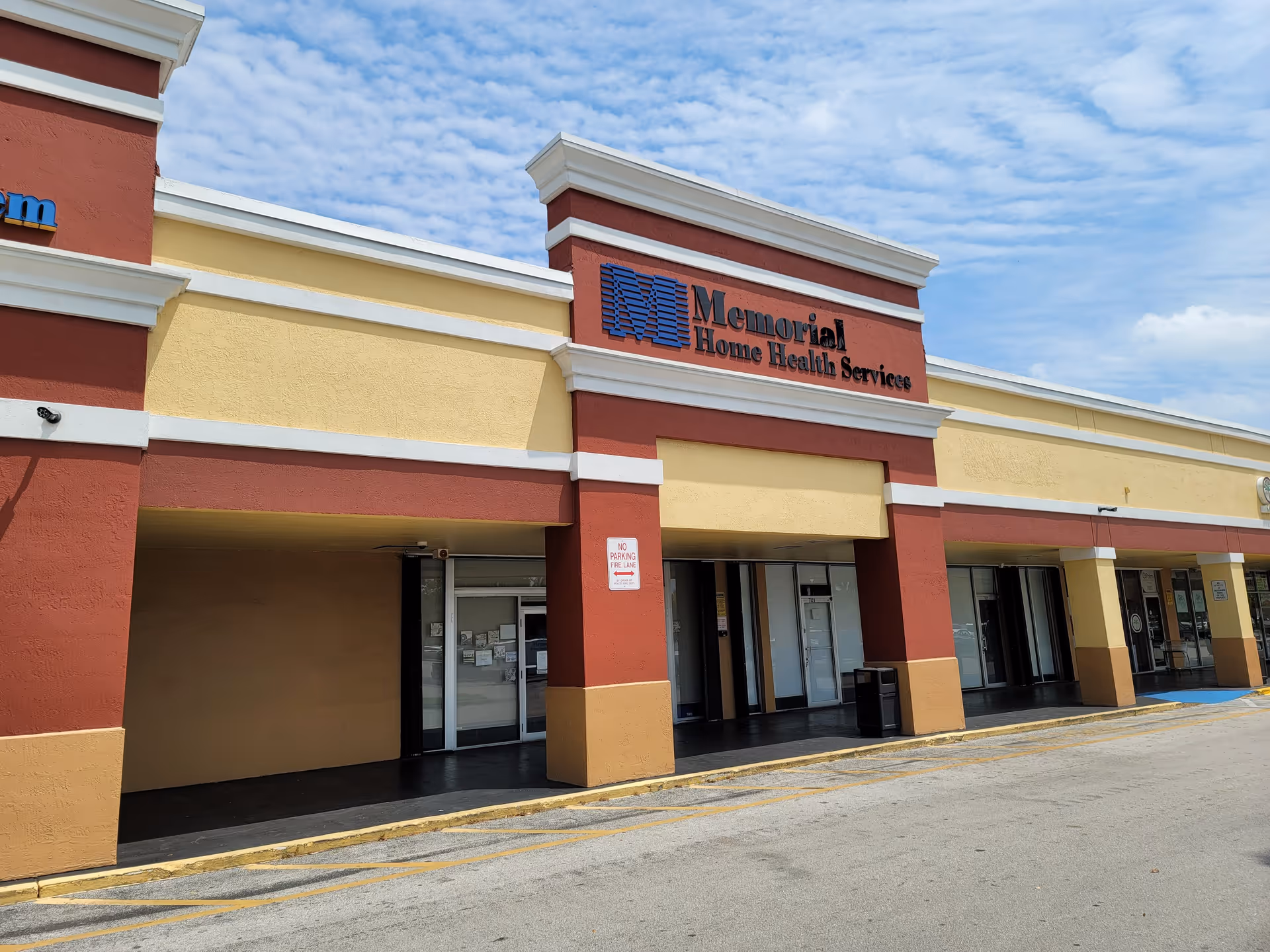 Front exterior of Memorial Home Health Services building with colorful facade and sign.