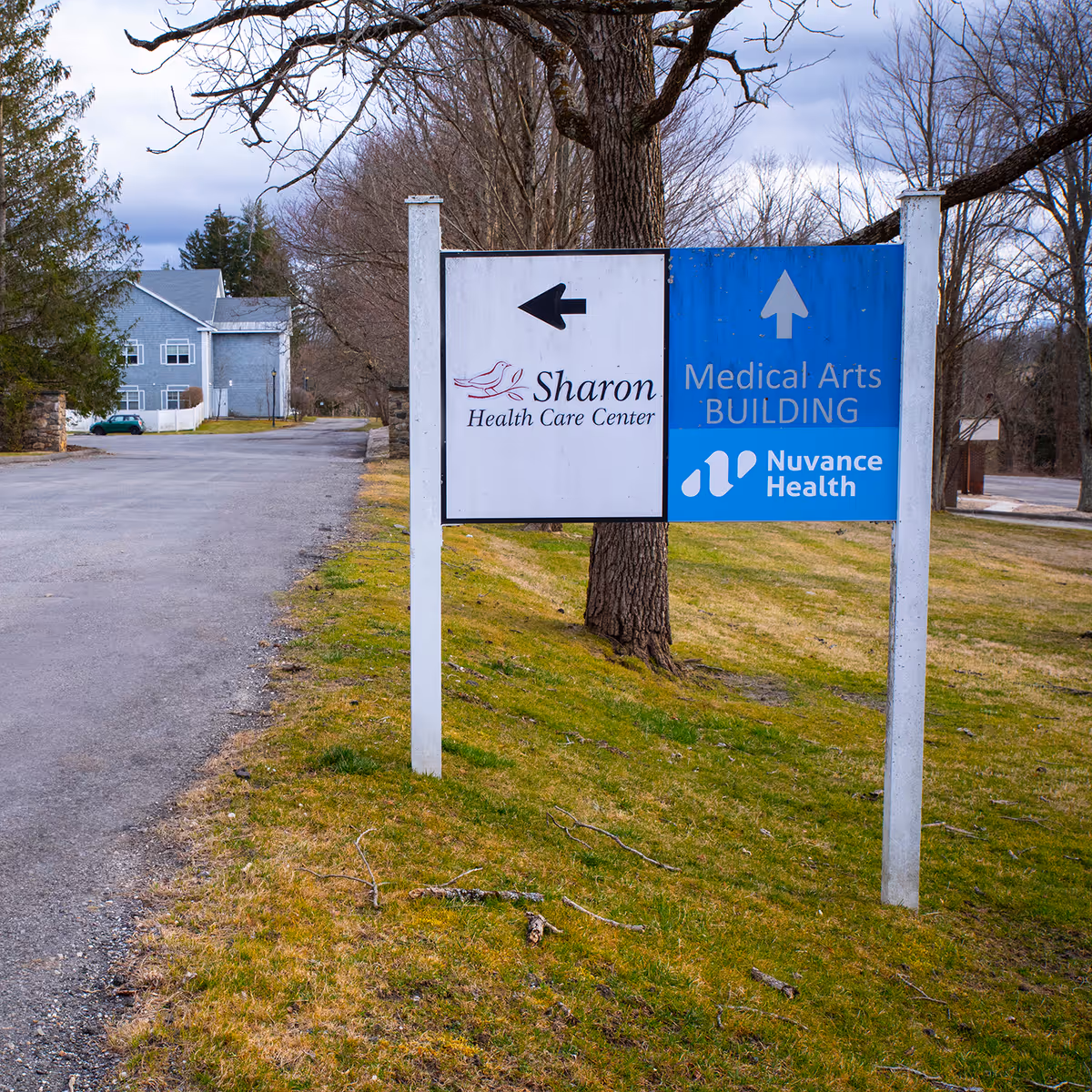 Outdoor sign for Sharon Health Care Center and Nuvance Health Medical Arts Building near road