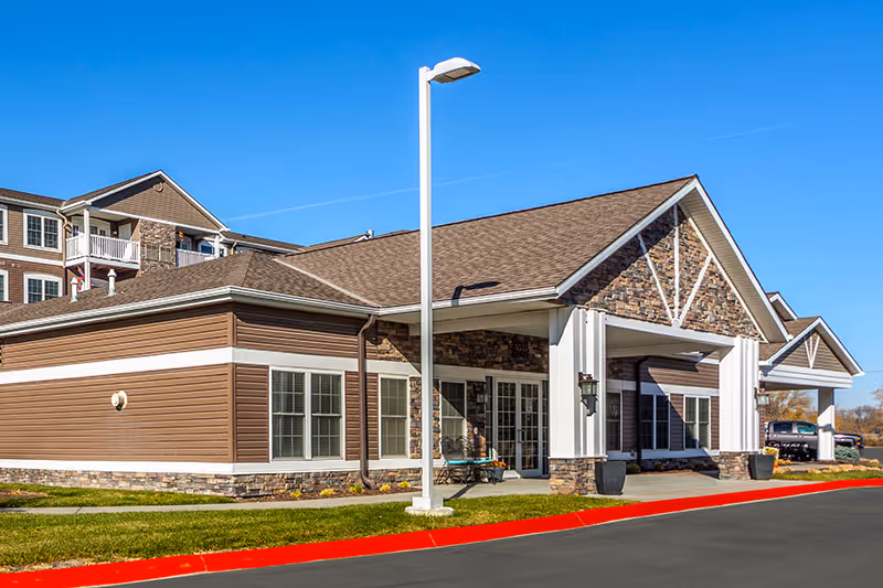 Exterior view of Connect55 Plus Elkhorn building with stone facade and entry.