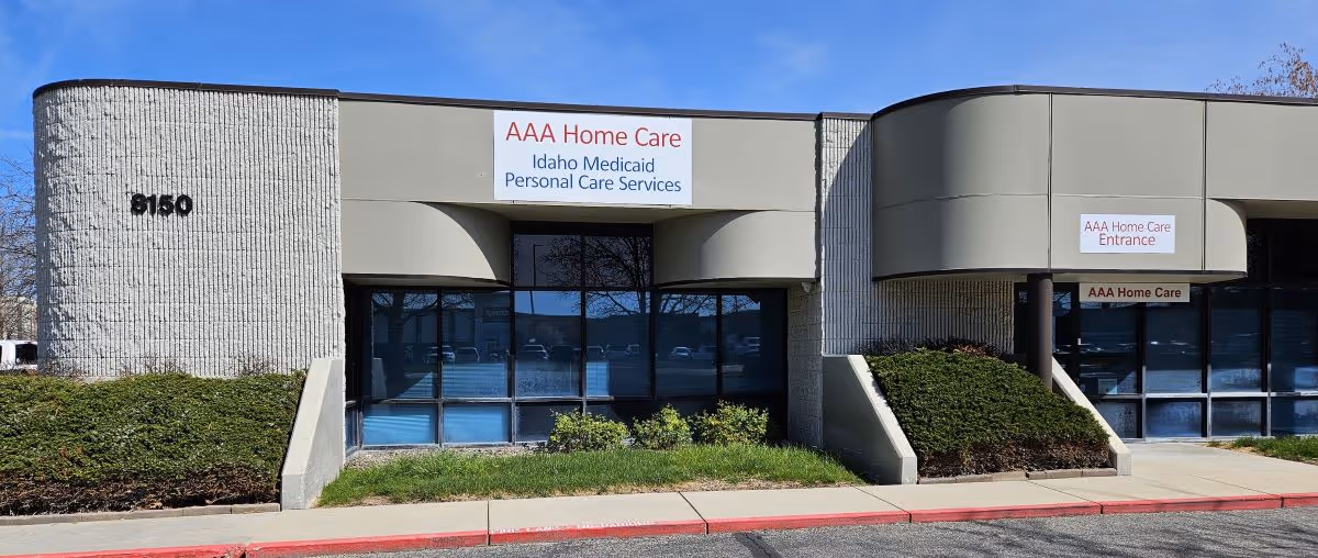 Exterior view of AAA Home Care building with sign and landscaping.