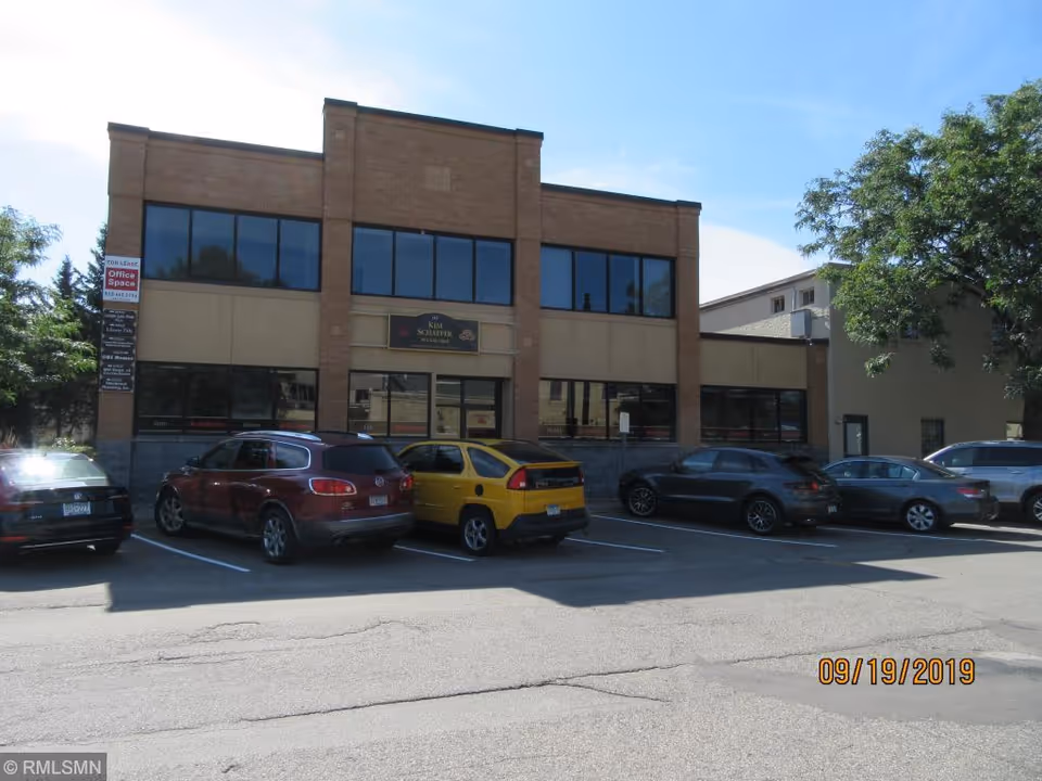 Dexterity International Home Health Care building exterior with large windows and parked cars.