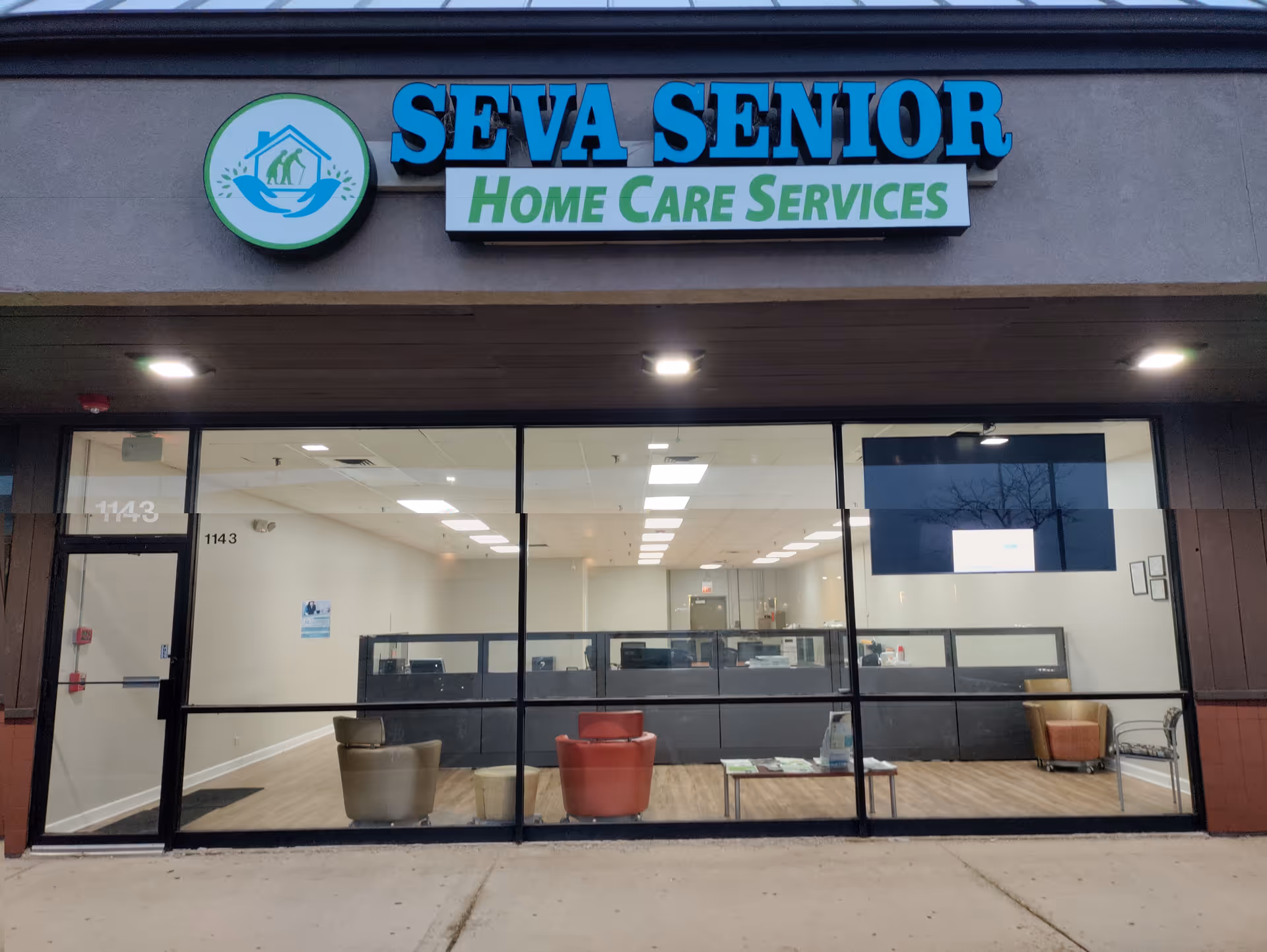 Exterior view of Seva Senior Home Care Services storefront with large glass windows.