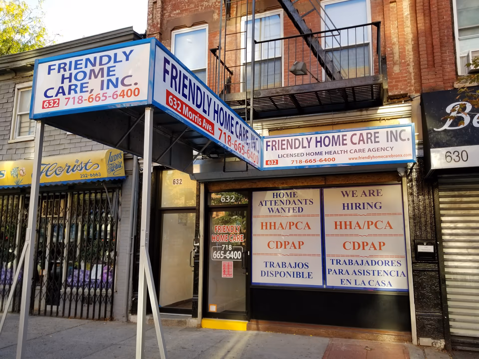 Storefront for Friendly Home Care Inc. with large blue signage on a brick building.