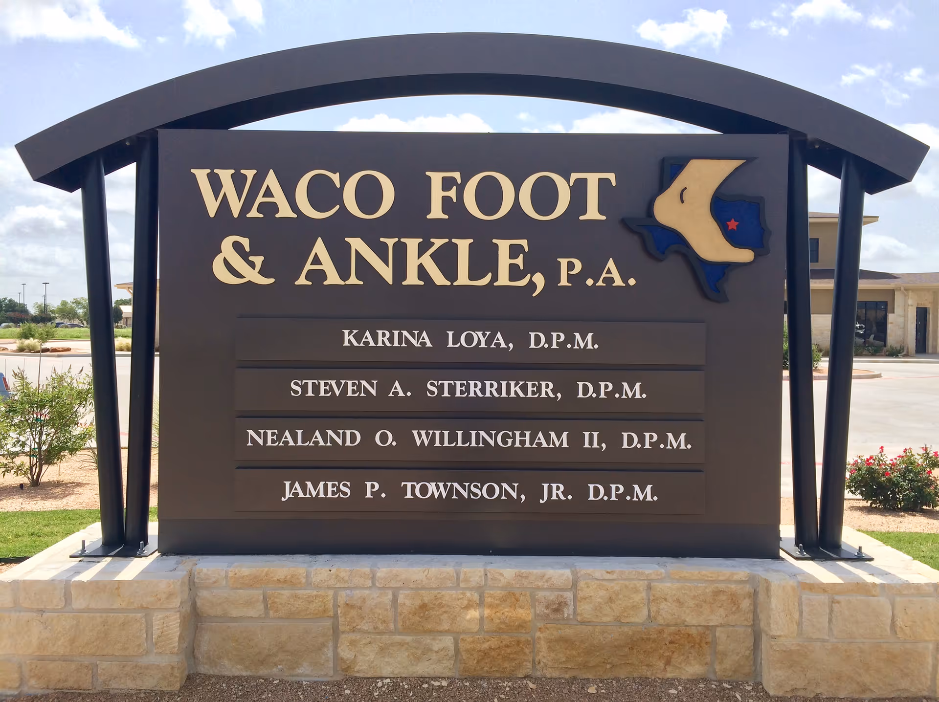 Outdoor sign for Waco Foot & Ankle, P.A., listing doctors' names.