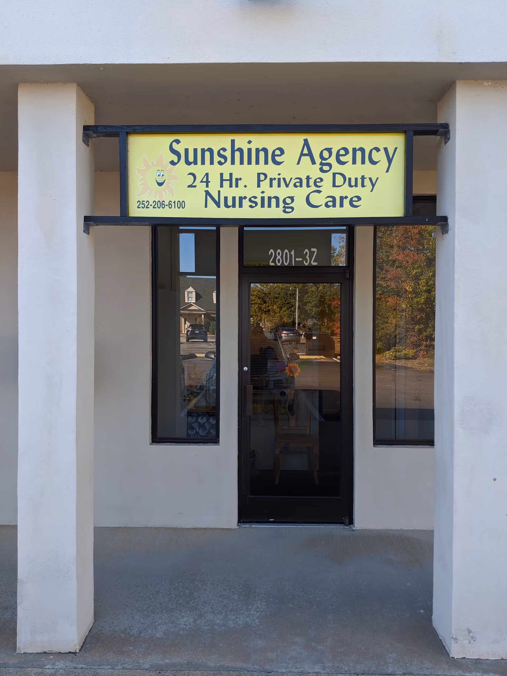 Front entrance of Sunshine Agency Nursing Care with a yellow sign