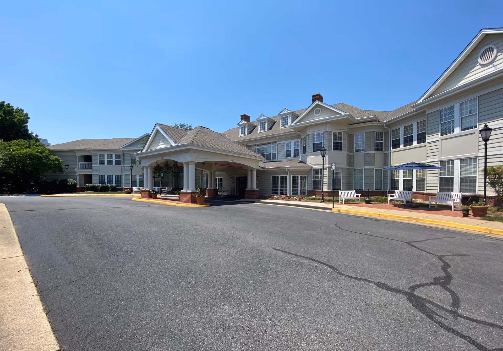 Exterior view of Sunrise at Reston Town Center with porte-cochere entrance.