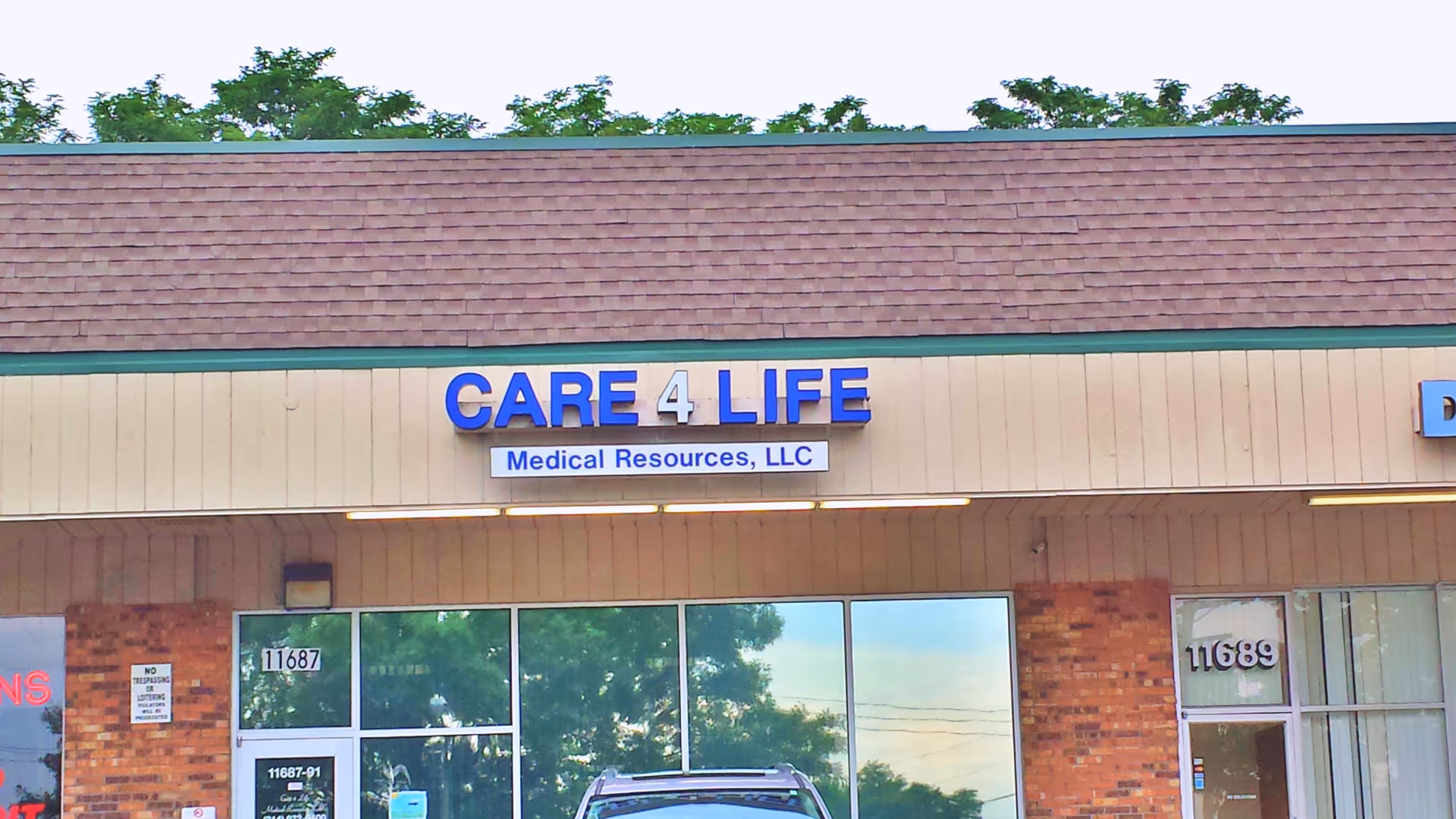 Exterior of a storefront with a blue CARE 4 LIFE sign displaying Medical Resources, LLC.
