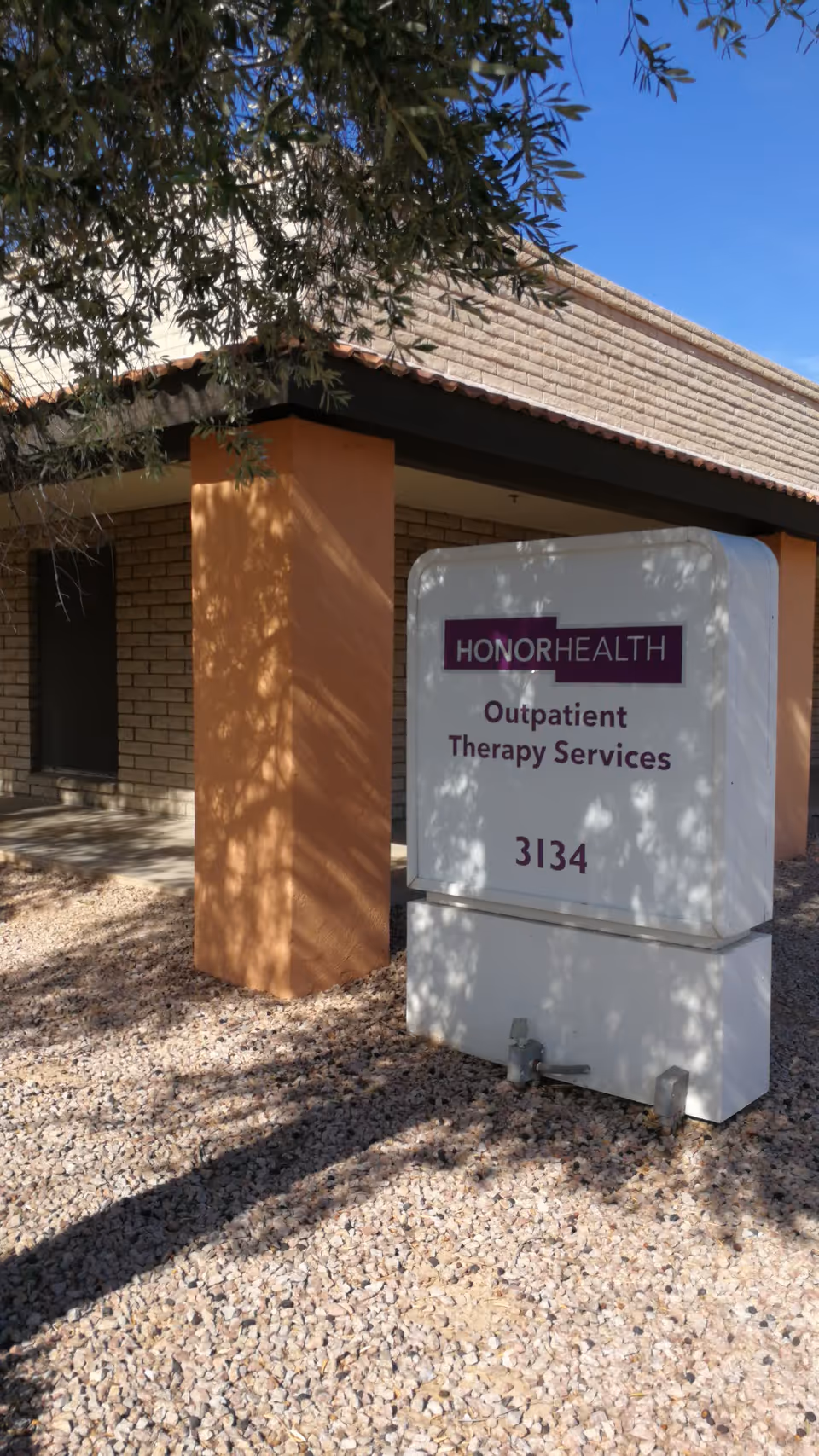 Exterior view of a building with an HonorHealth Outpatient Therapy Services sign.