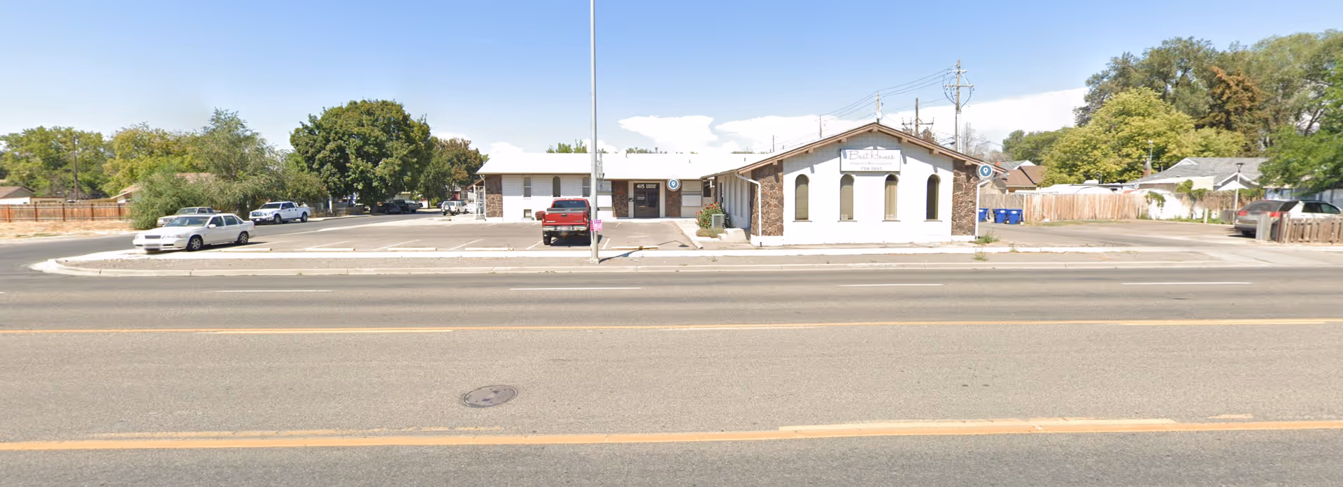 Wide exterior view of Premier Home Care building with parking lot.