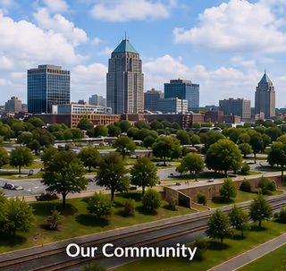 City skyline beyond a manicured park with trees and winding pathways.