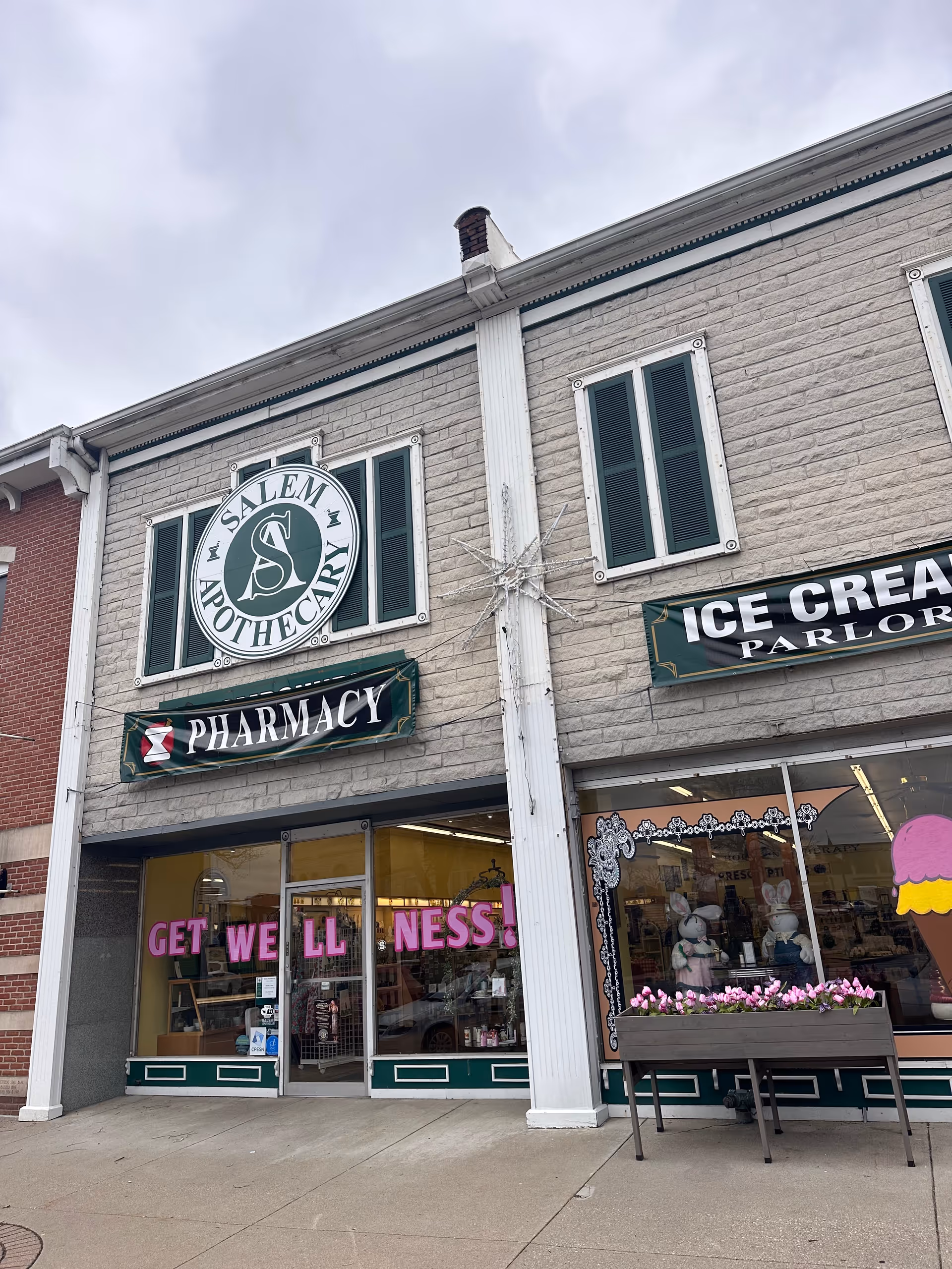 Brick storefront with Salem Apothecary signs, pharmacy and ice cream parlor.